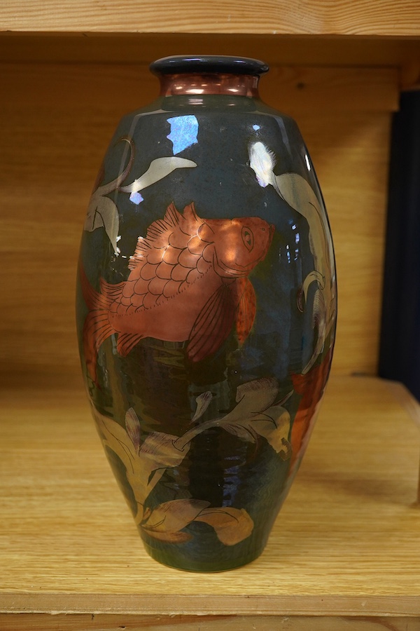 A Jonathan Chiswell Jones lustre vase hand painted with carp, signed to the base, 30cm high. Condition - good, firing crack to the base